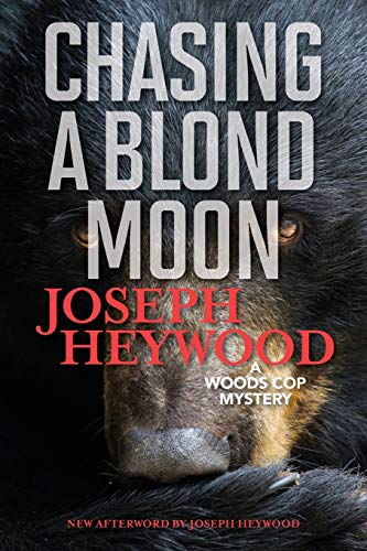 Chasing a Blond Moon A Woods Cop Mystery [Paperback]
